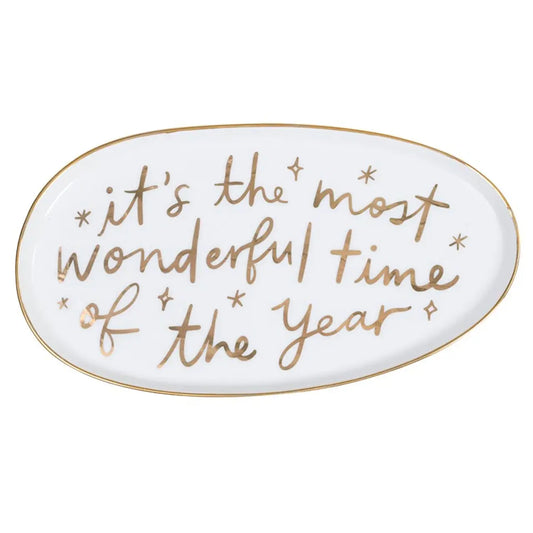 White oval ceramic platter with gold rim and gold foil script reading 'It's the Most Wonderful Time of the Year' on white background – Bliss by Cori