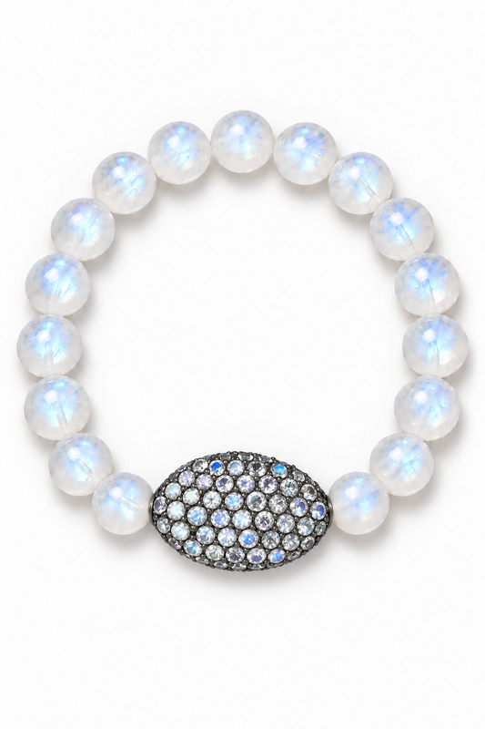 Bracelet on white background: Round Rainbow Moonstone beads with blue flashes and an oval pavé accent on a white background | Bliss by Cori