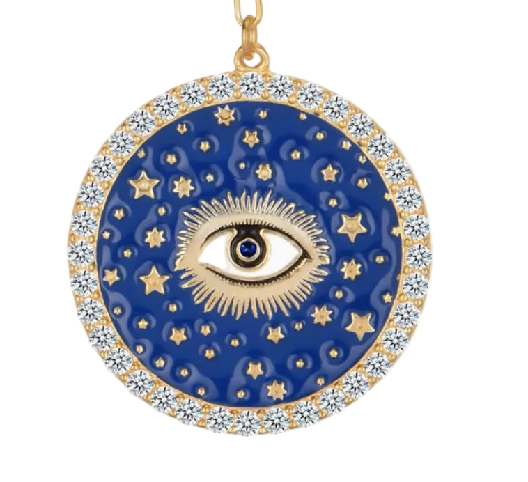Close-up detail of gold evil eye coin pendant with blue enamel, gold stars, and crystal diamond halo border on Lapis Lazuli necklace