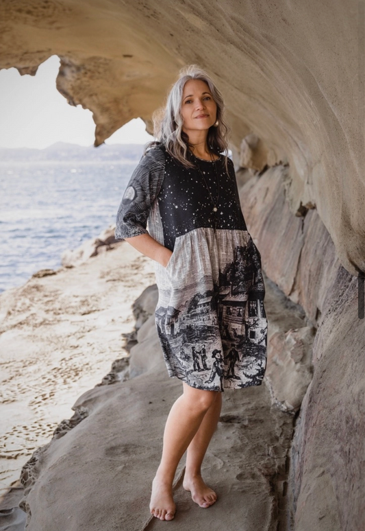 Close-up of Stargazer Artist Dress neckline and star field print with moon detail on sleeve — celestial viscose shift dress | Bliss by Cori Boutique