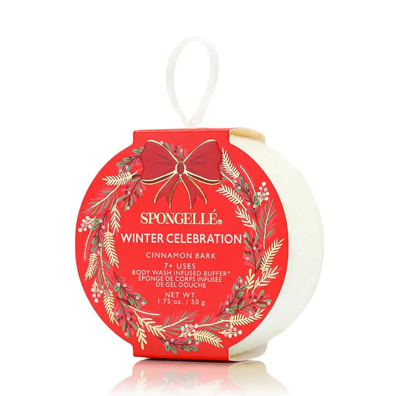 Spongellé Winter Celebration Cinnamon Bark body buffer ornament in red holiday wreath packaging on white background — Bliss by Cori Boutique