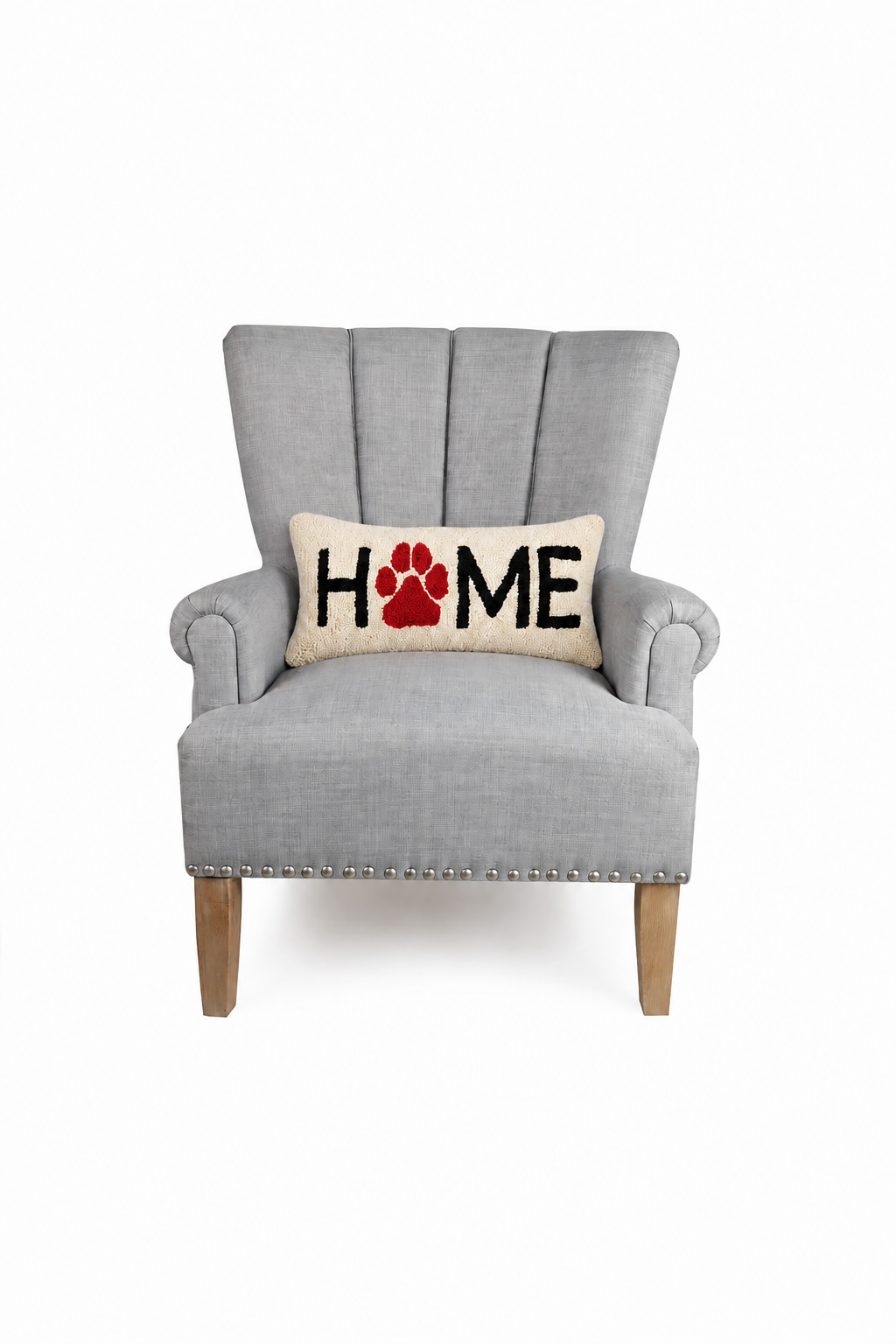 Home paw print hooked wool throw pillow displayed on grey armchair | Bliss by Cori