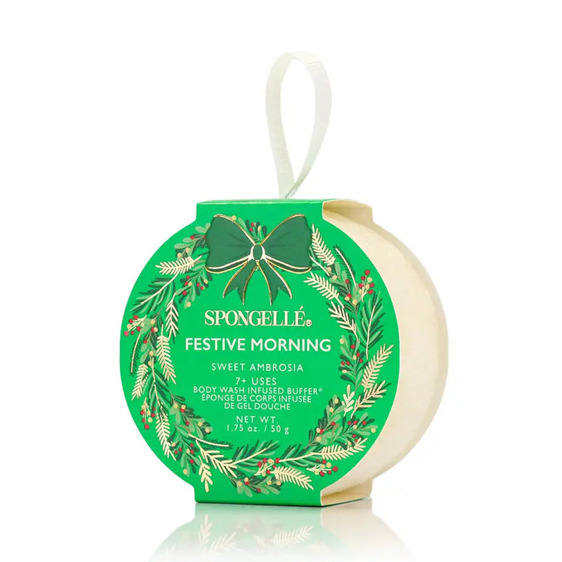 Spongellé Festive Morning Sweet Ambrosia body buffer ornament in green holiday wreath packaging on white background — Bliss by Cori Boutique