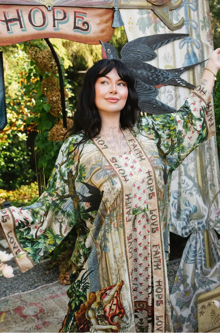  Book of Love duster worn open over a floral outfit, showing swallow motifs and Faith Hope Love trim | Bliss by Cori