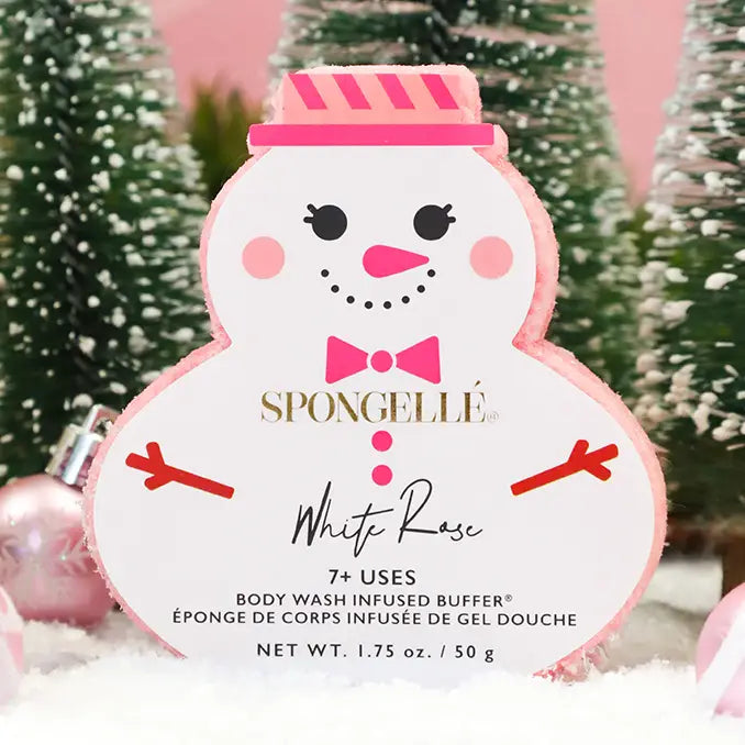 Spongellé White Rose snowman body buffer in holiday scene with snow-flocked trees and pink ornaments — Bliss by Cori Boutique
