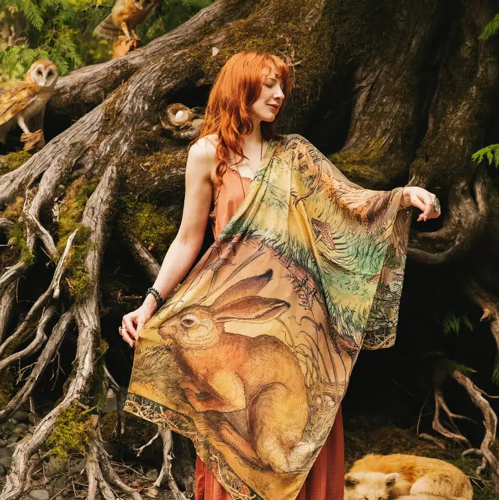 Close-up of Woodland Wisdom Bohemian Scarf showing detailed rabbit centrepiece illustration with moth and botanical border in warm earthy greens and golds — Bliss by Cori