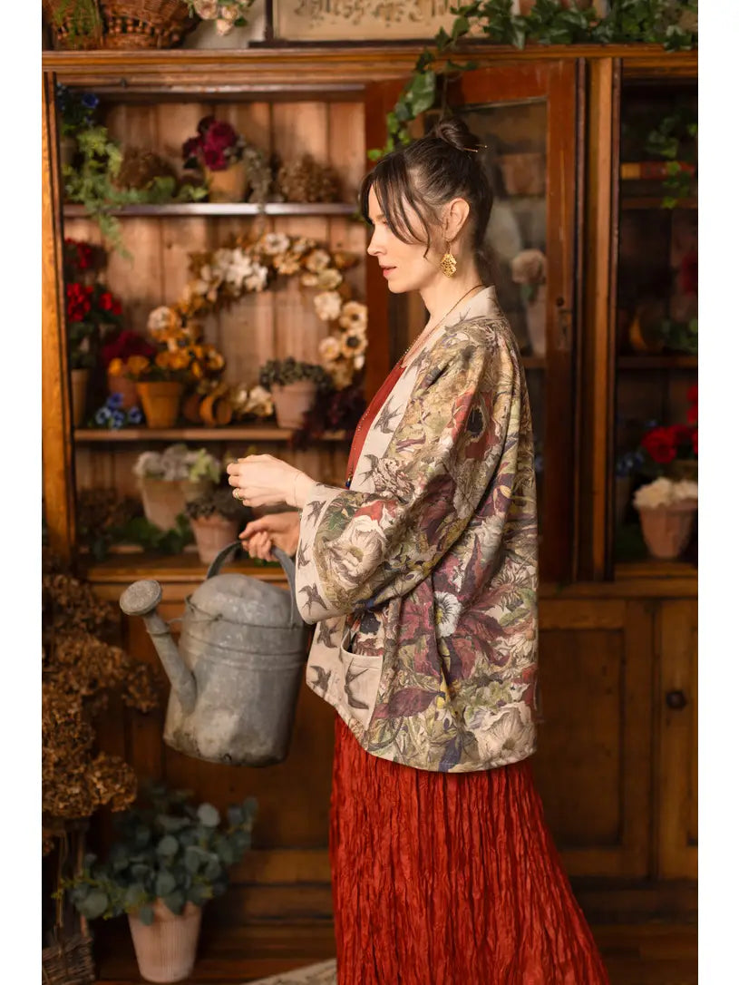 Close-up of Golden Hour Cottage Jacket pocket with swallow engraving and floral print | Bliss by Cori