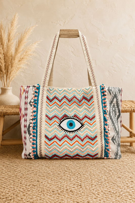 Multicolor chevron embroidered boho tote bag with evil eye detail and pom-pom trim | Bliss by Cori