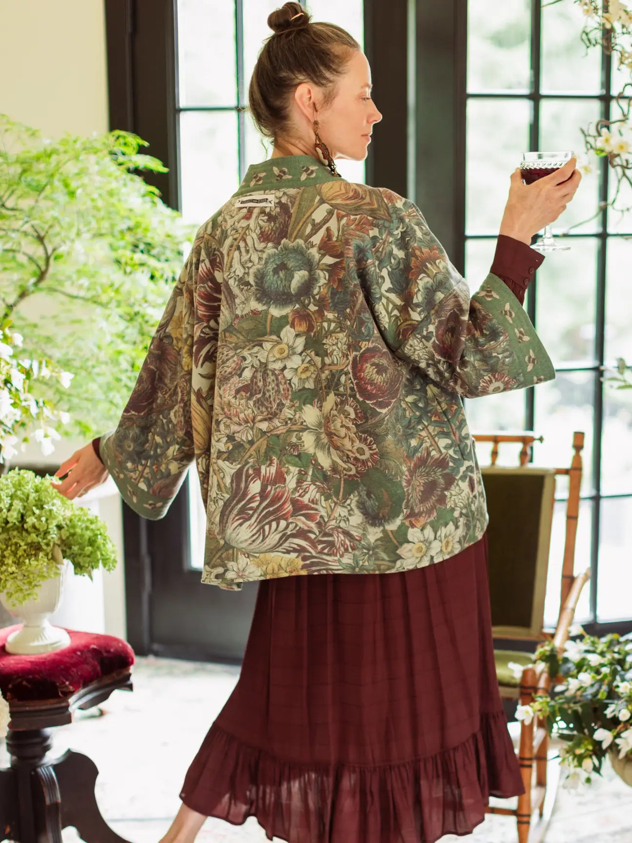 Model wearing Love Grows Wild Cottage Jacket open front in bright garden room | Bliss by Cori