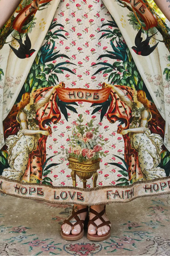 Book of Love dress skirt detail with swallows, pink flowers, vintage figures, and Faith Hope Love hem | Bliss by Cori