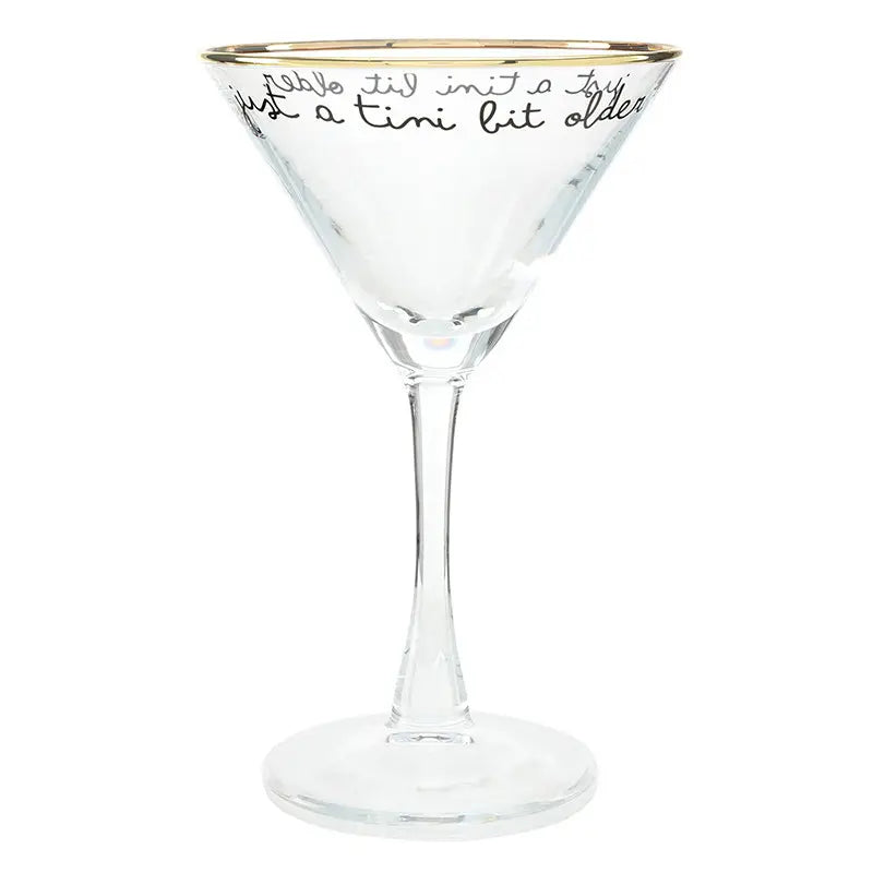 Clear martini glass with gold rim and just a tini bit older black cursive script lettering around the rim on white background – Bliss by Cori
