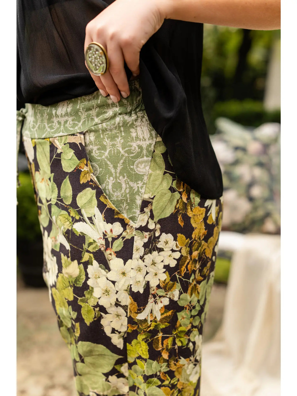 Side close-up showing the waistband, pocket and botanical print of the Equinox Artist Pants | Bliss by Cori