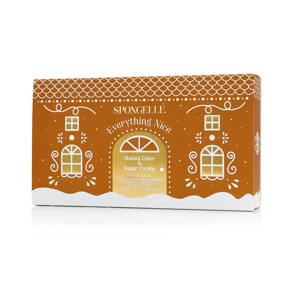 Spongellé Everything Nice gingerbread house gift box exterior in warm orange with gold Everything Nice lettering — Bliss by Cori Boutique