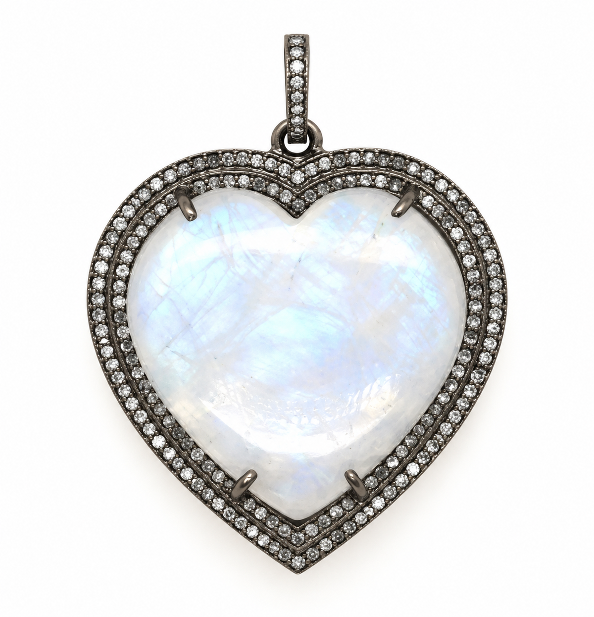 Close-up of a luminous heart-shaped moonstone pendant framed with genuine diamonds in sterling silver | Bliss by Cori