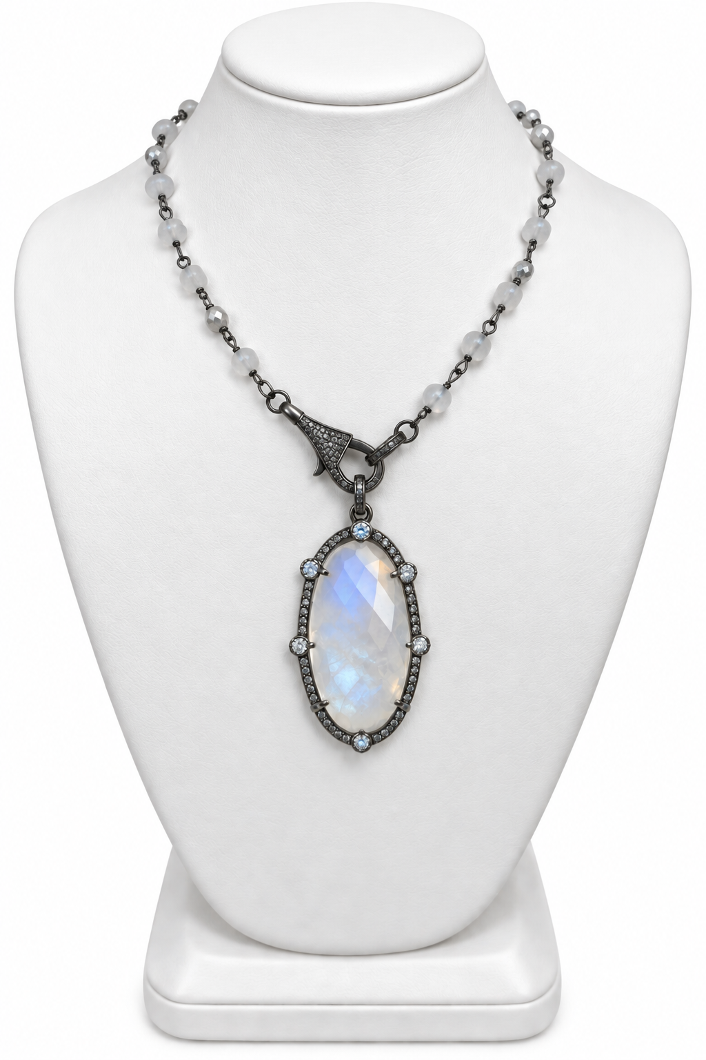 Genuine moonstone and diamond sterling silver necklace displayed on a white jewelry stand | Bliss by Cori