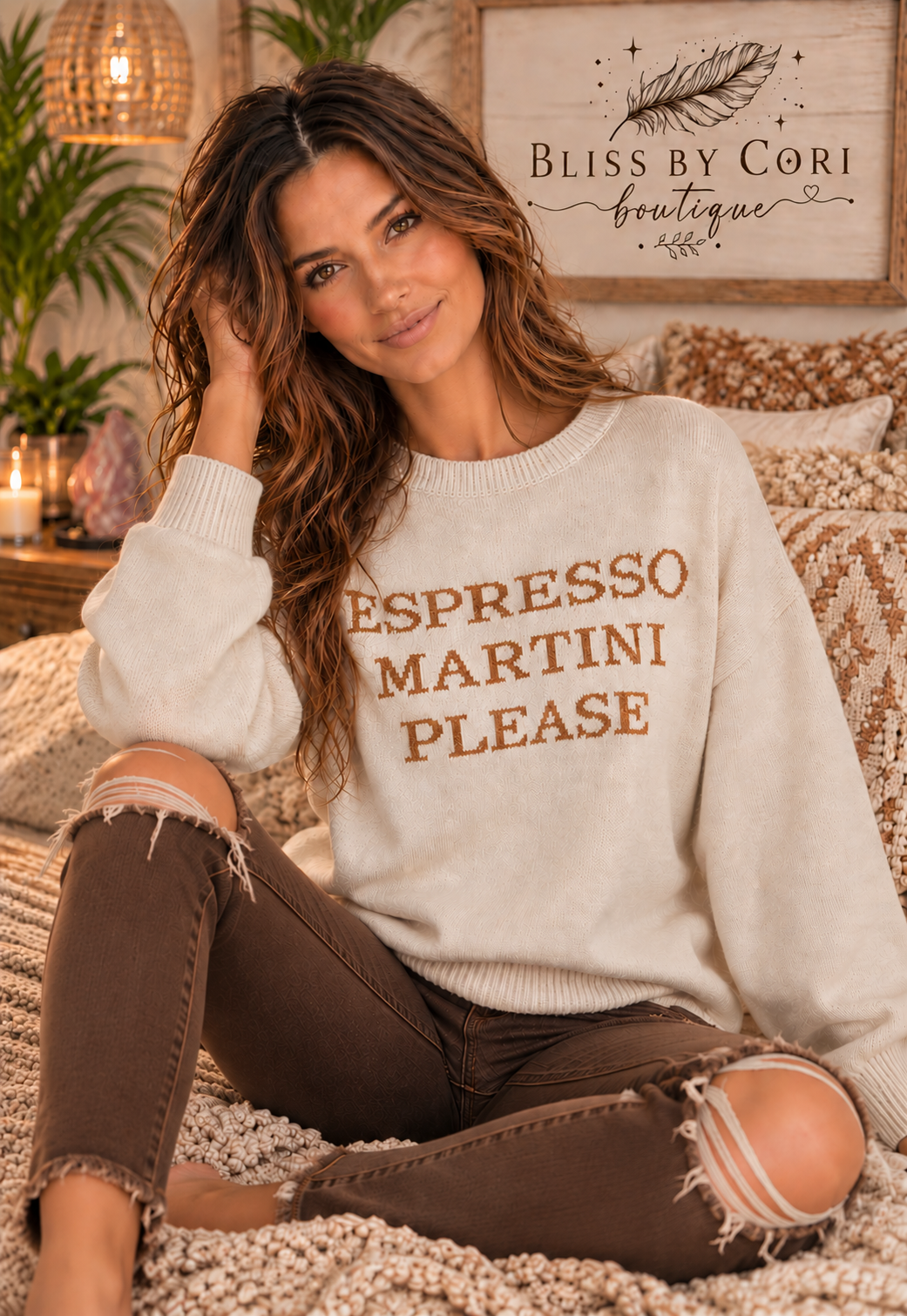Model seated in a cream “Espresso Martini Please” graphic sweater, showing its relaxed fit and ribbed cuffs | Bliss by Cori