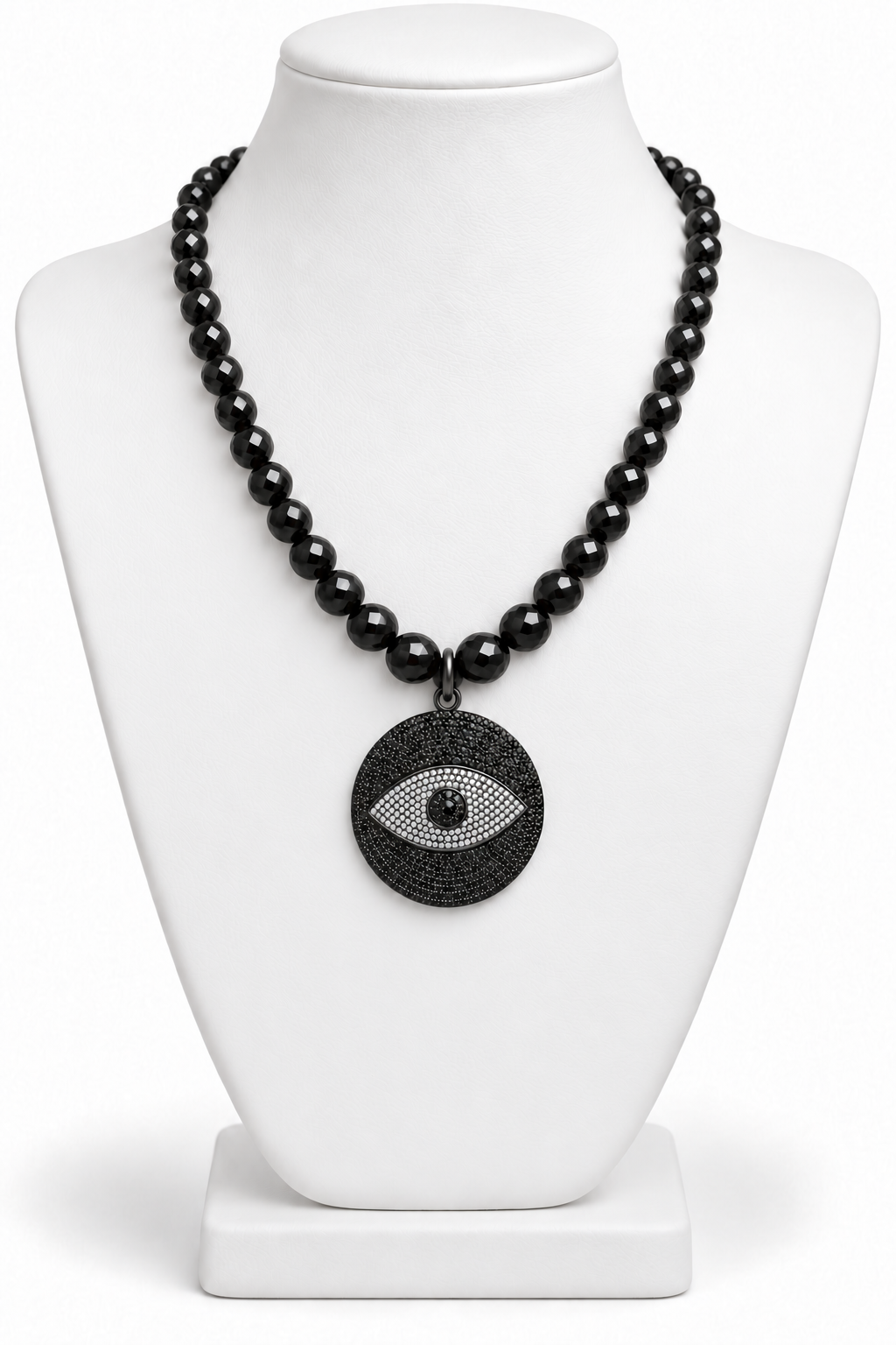 Faceted black spinel beaded necklace with a round black and white evil eye pendant displayed on a white jewelry bust | Bliss by Cori