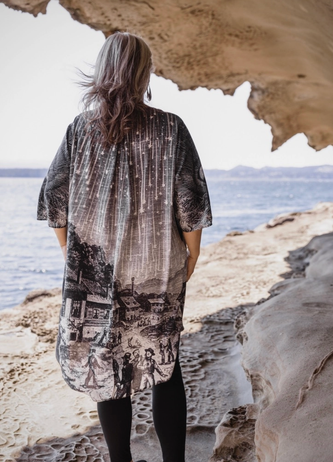 Close-up detail of Stargazer Artist Dress skirt showing 1833 Leonid meteor shower engraving with village and figures | Bliss by Cori Boutique