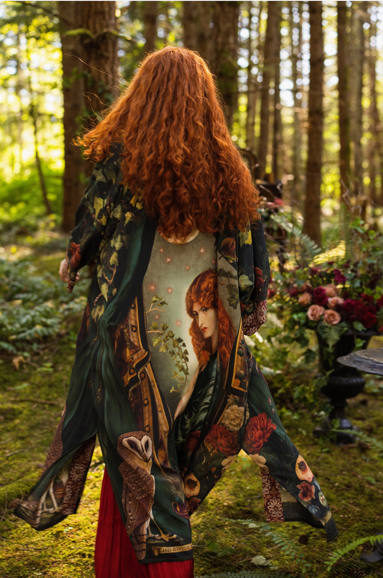 Close-up of Solstice Opera Duster Kimono front opening and tapestry-trim border detail with warm terracotta and gold tones on dark green — Bliss by Cori