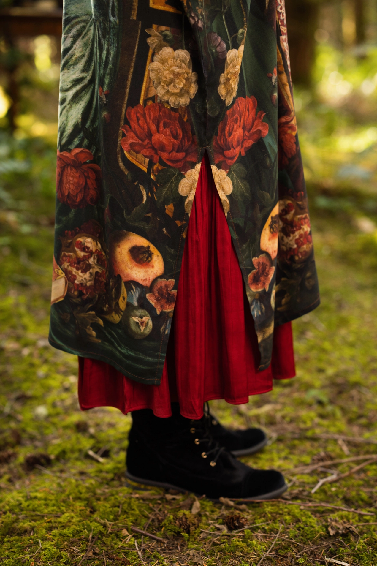 Detail shot of Solstice Opera Duster Kimono showing ivy, pomegranate and floral border print with deep green velvet-toned fabric and tapestry-inspired trim — Bliss by Cori