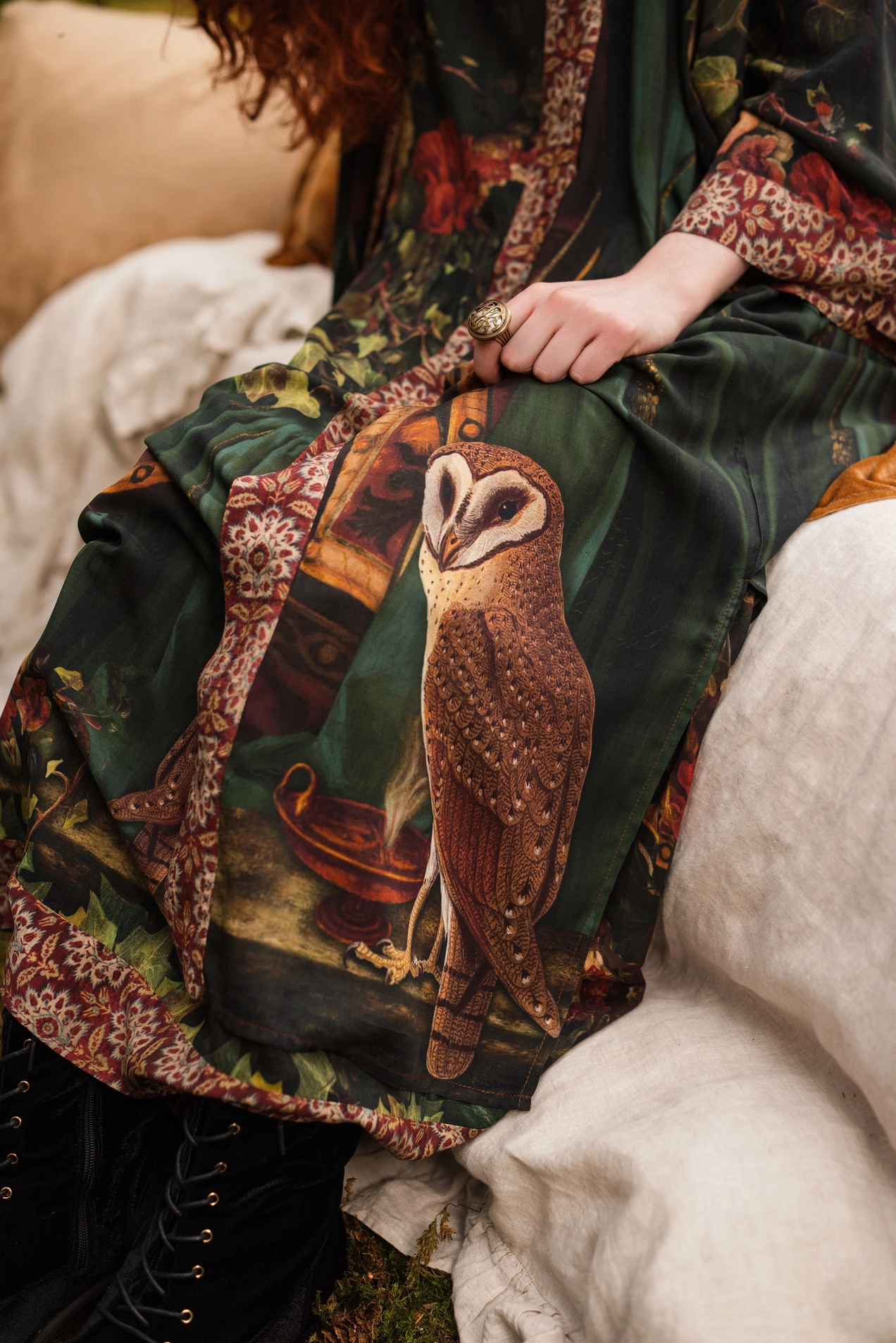 Detail of Solstice Opera Duster Kimono showing Proserpine portrait surrounded by florals, ivy and pomegranate on dark forest green fabric — Bliss by Cori