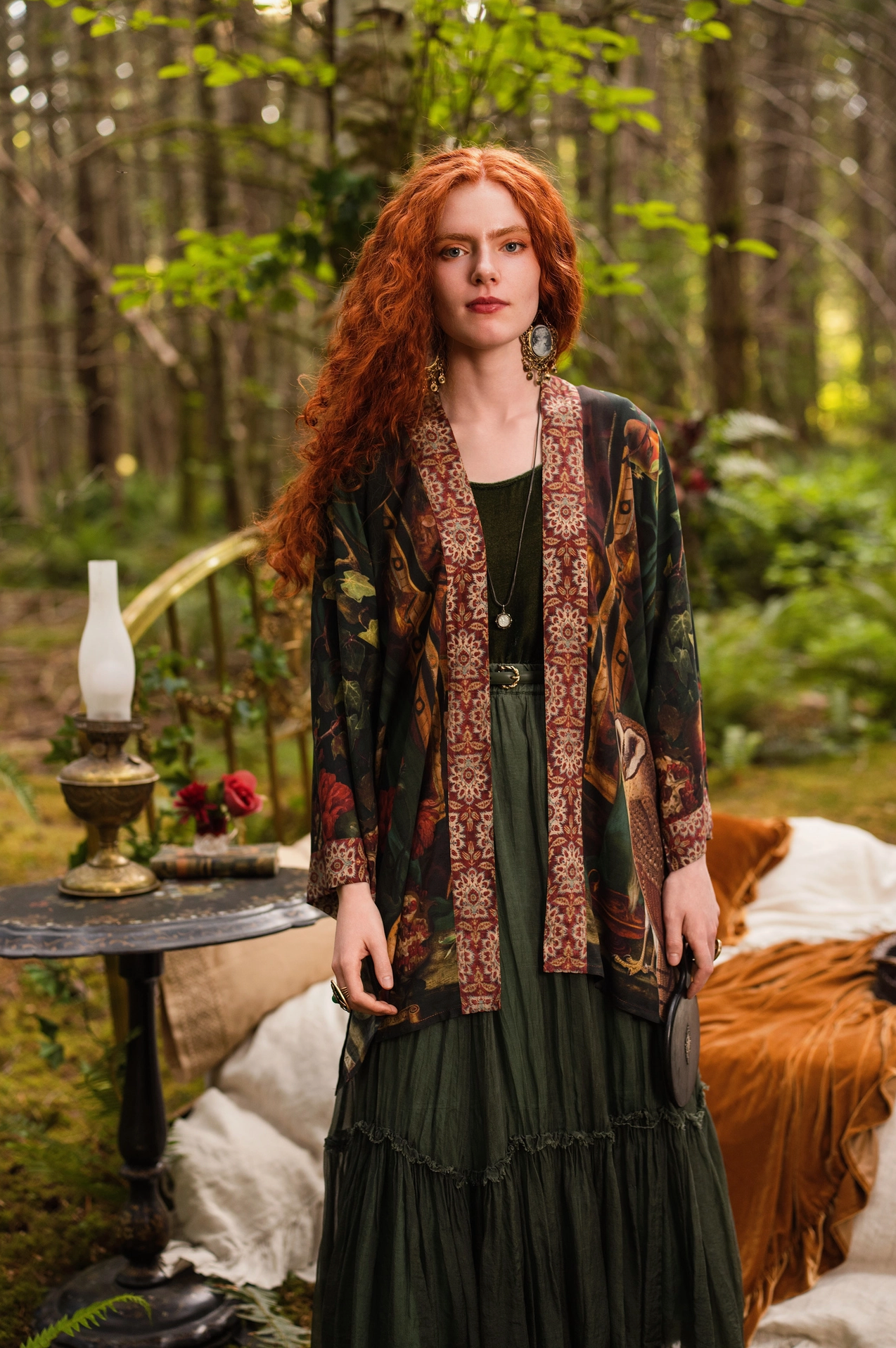 Detail of Solstice Matinée Mid-Length Duster Kimono showing pomegranate and floral print on deep forest green with warm earthy tapestry border trim — Bliss by Cori
