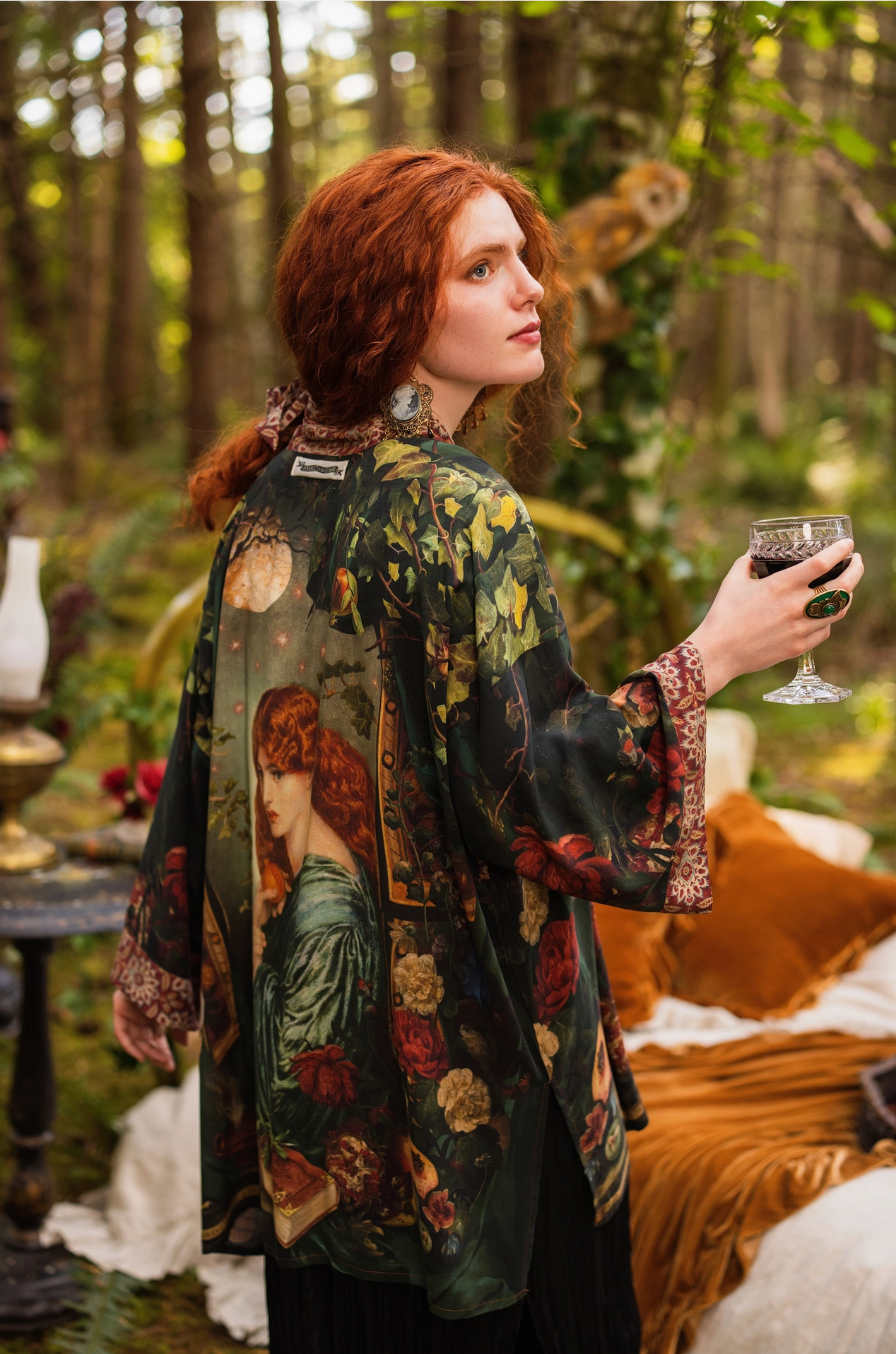 Detail of Solstice Matinée Mid-Length Duster Kimono showing tapestry-inspired border trim with warm terracotta mandala print and dark green Proserpine print panel — Bliss by Cori