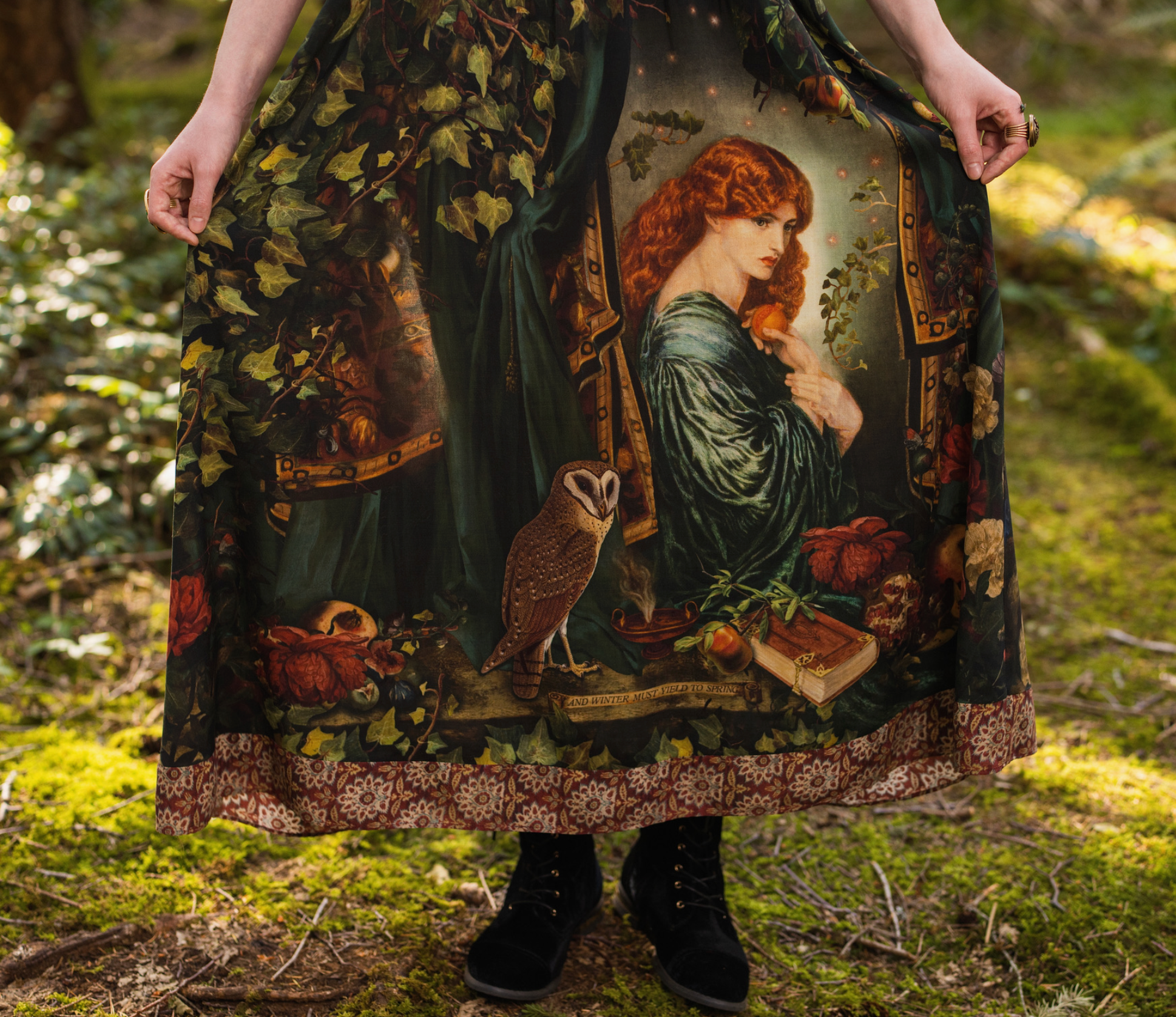Close-up of Solstice Bohéme Maxi Slip Dress showing barn owl illustration and pomegranate print detail on deep forest green viscose with tapestry hem border — Bliss by Cori