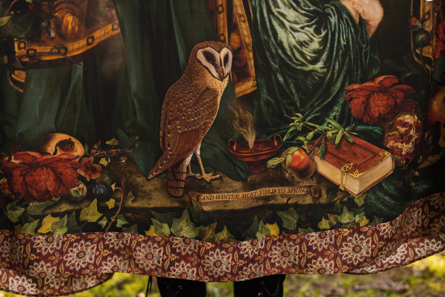 Detail of Solstice Bohéme Maxi Slip Dress showing Rossetti Proserpine portrait with roses, pomegranate, owl and antique book print on deep forest green viscose — Bliss by Cori