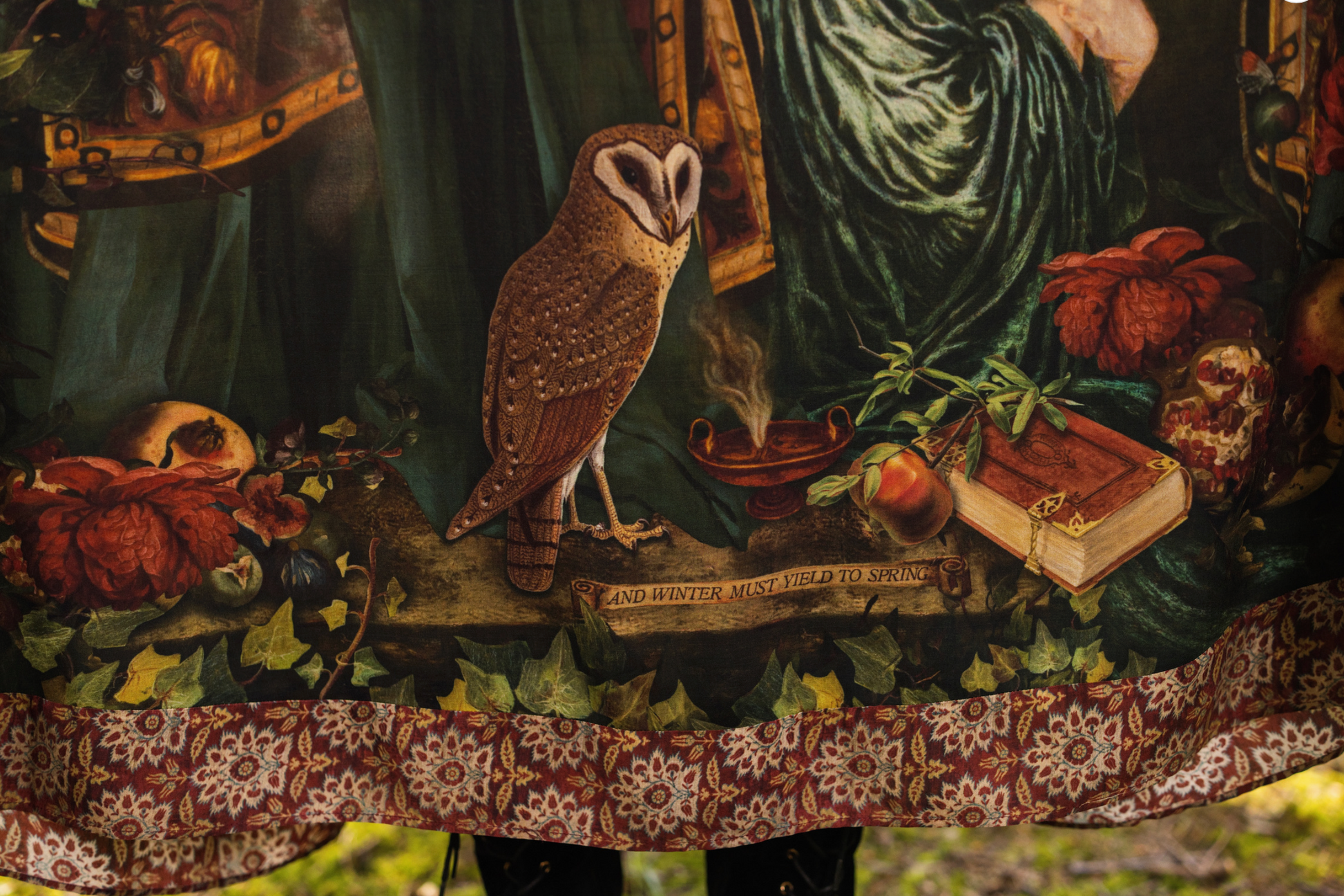 Detail of Solstice Bohéme Maxi Slip Dress showing Rossetti Proserpine portrait with roses, pomegranate, owl and antique book print on deep forest green viscose — Bliss by Cori