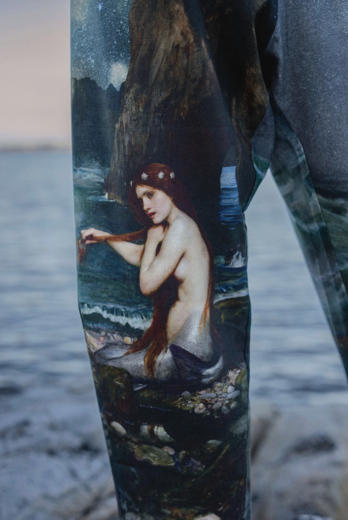 Back view of the Siren cropped pants with arms extended beside the sea | Bliss by Cori