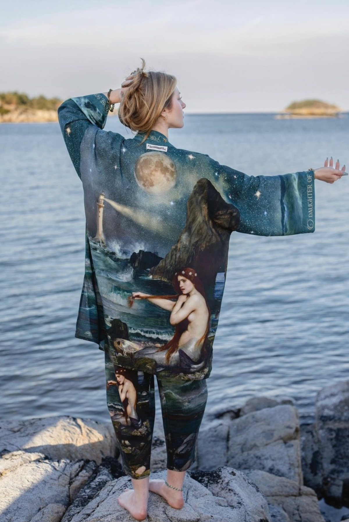 Back view of the Market of Stars Siren Matinée Duster with moon and mermaid artwork beside the sea | Bliss by Cori