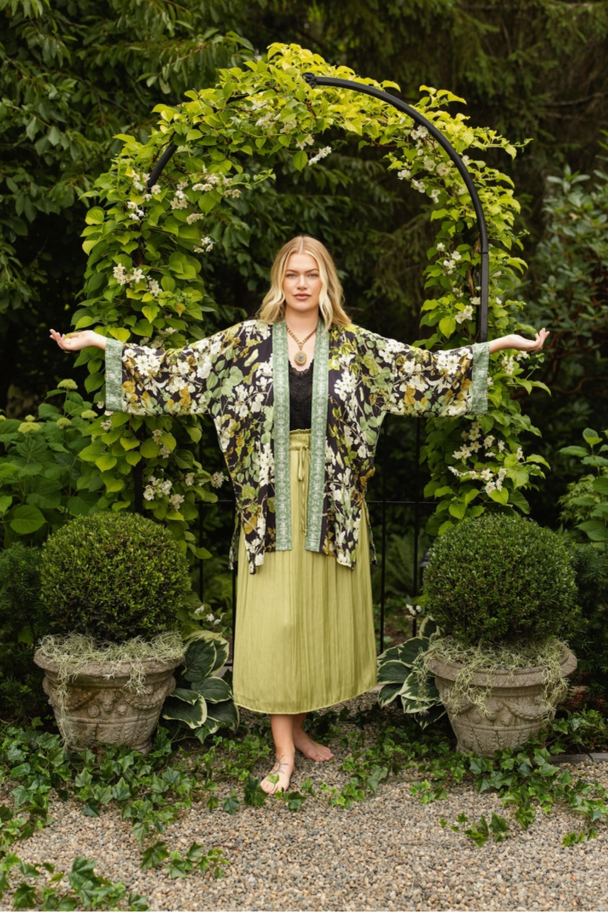 Model holding her arms out to show the wide sleeves and flowing shape of the Equinox duster | Bliss by Cori