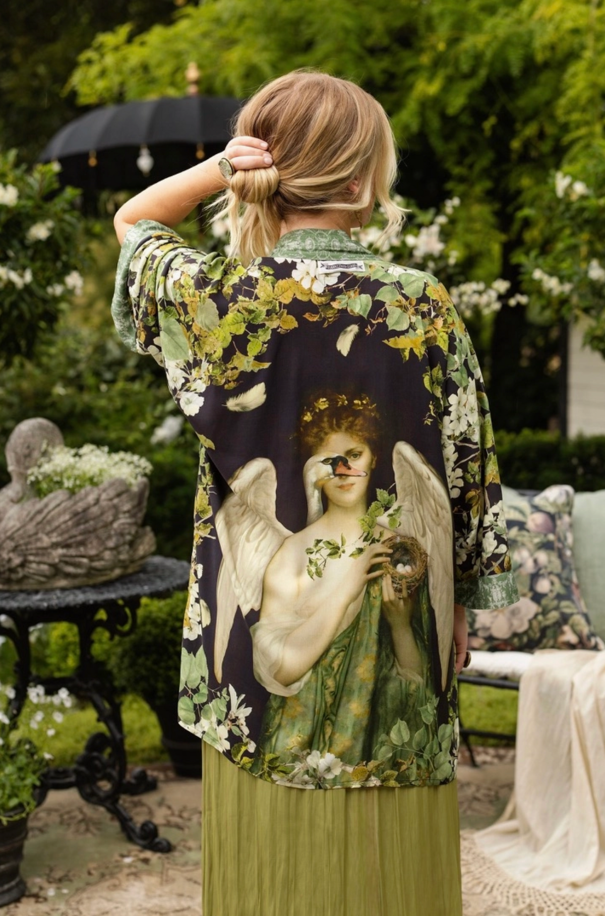 Full back view of the Equinox duster with large Pandora and swan artwork in a garden | Bliss by Cori