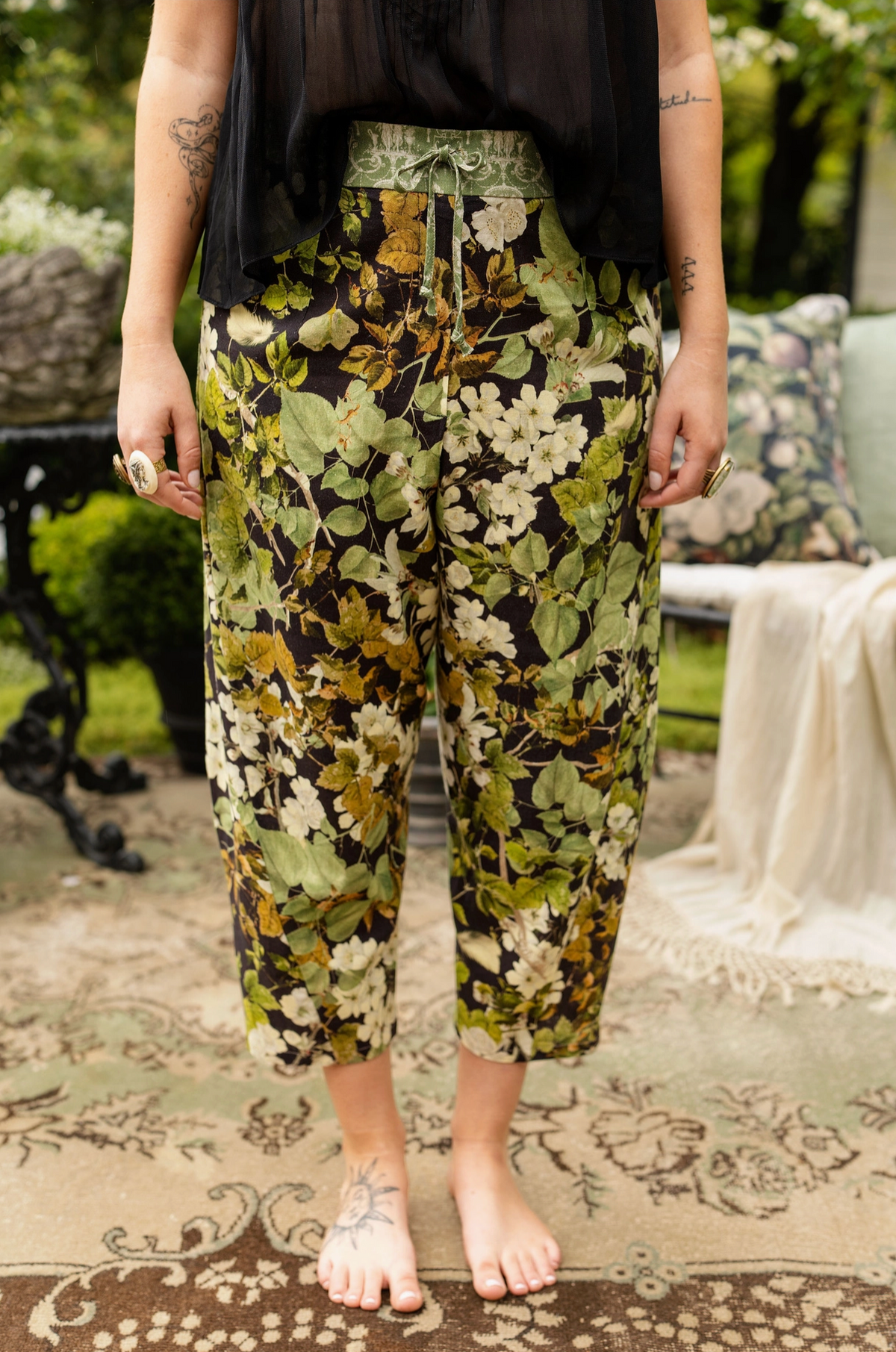 Front view showing the relaxed cropped silhouette and botanical artwork of the Equinox Artist Pants | Bliss by Cori