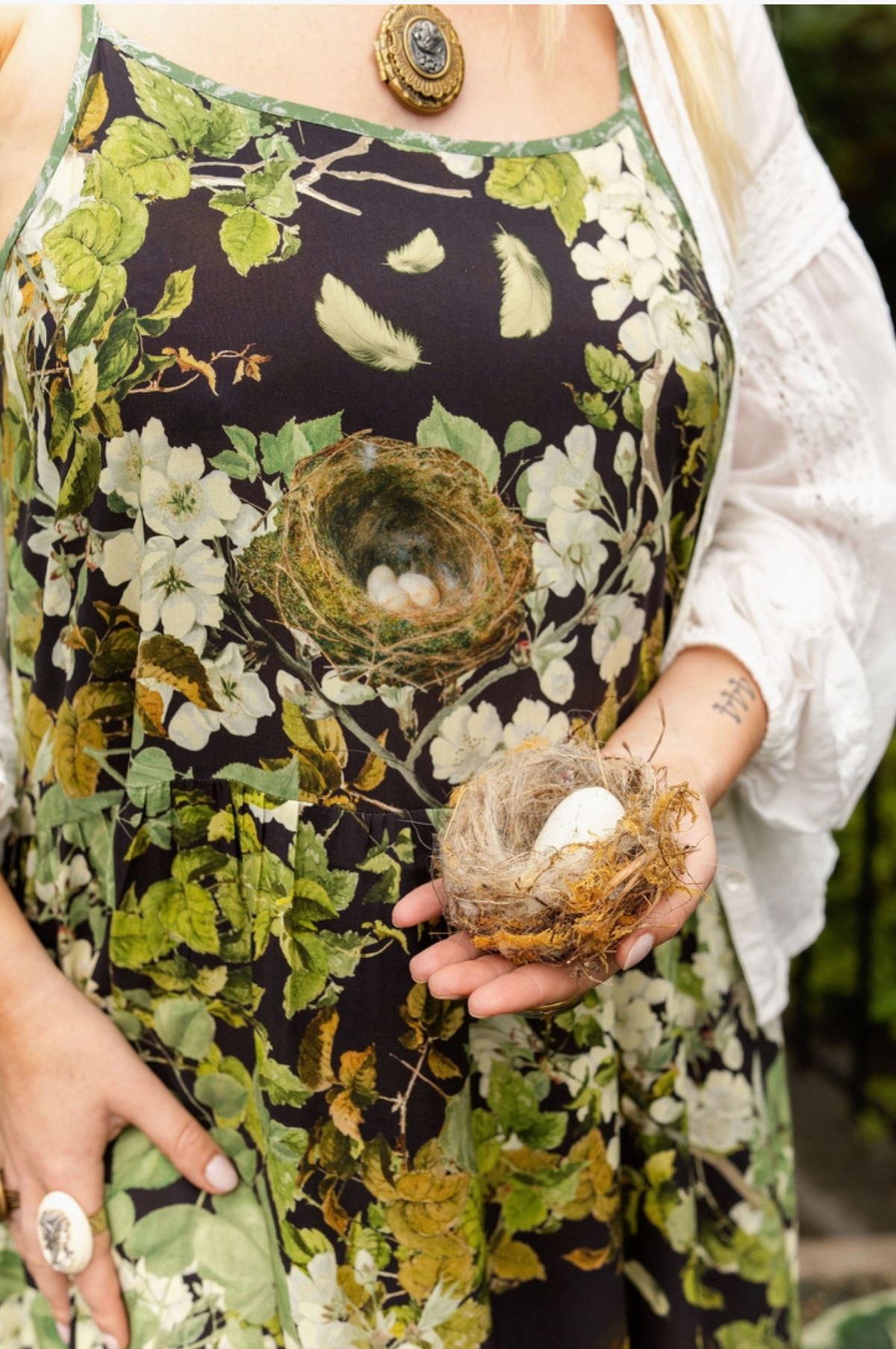 Close-up of the Equinox maxi dress bodice with apple blossoms, leaves and dark botanical print | Bliss by Cori
