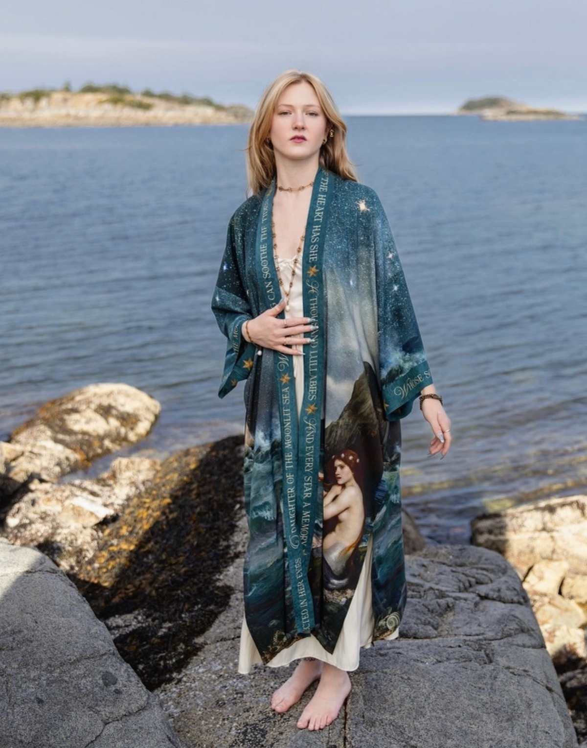 Full-length front view of the Market of Stars Siren duster styled on a rocky shoreline | Bliss by Cori