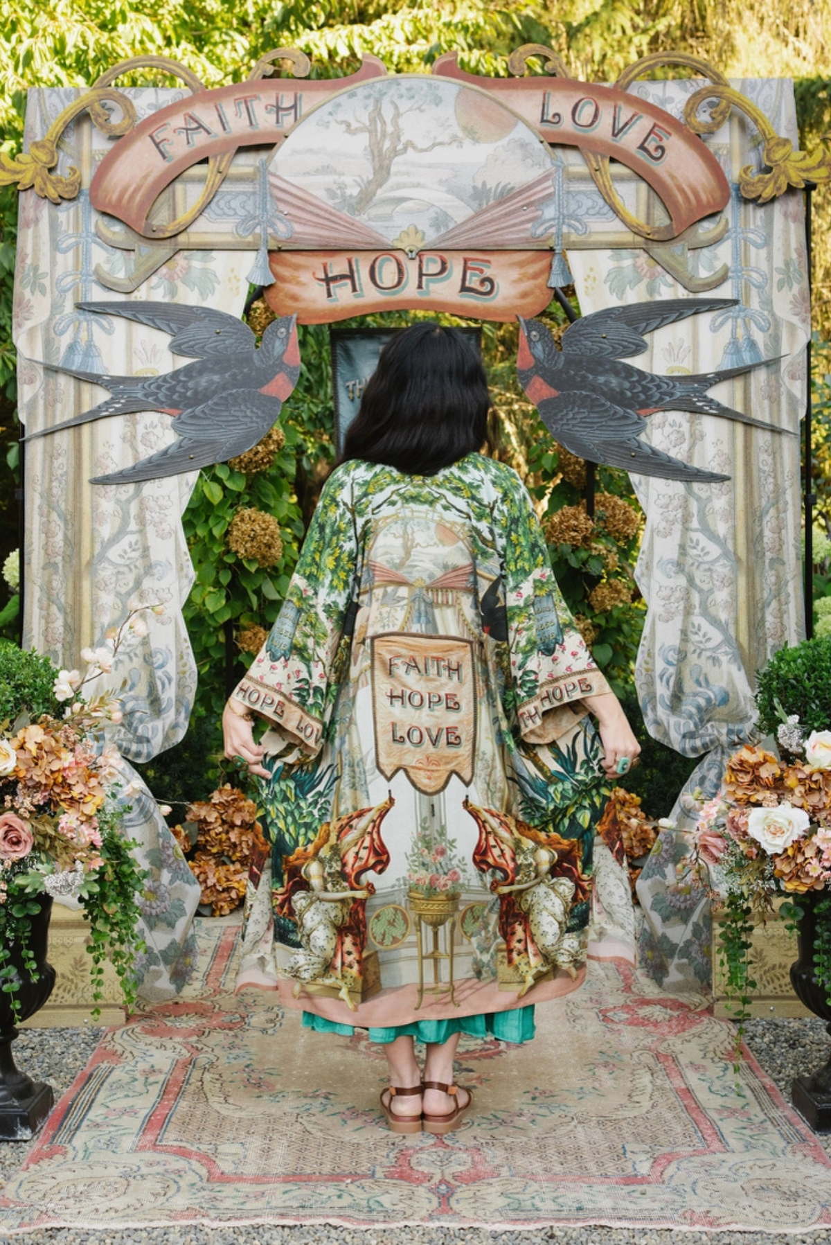 Back of Book of Love duster showing Faith Hope Love banner, green foliage, and vintage-inspired artwork | Bliss by Cori