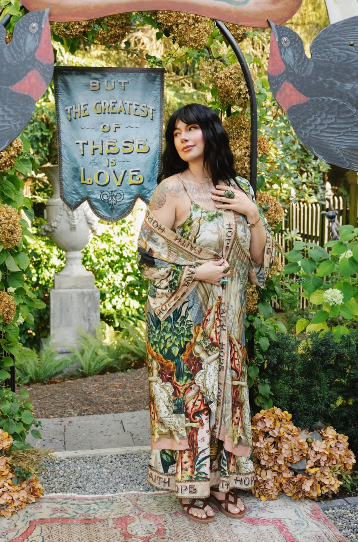 Model wearing Book of Love duster draped off one shoulder over a coordinating printed dress | Bliss by Cori