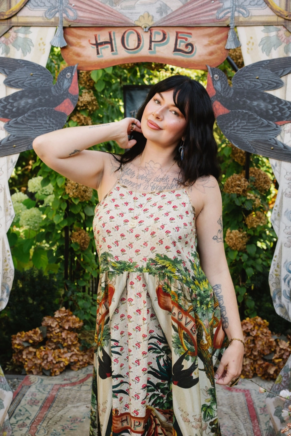 Close-up of Book of Love dress showing tiny pink flowers on the bodice, thin straps, and leafy waist detail | Bliss by Cori