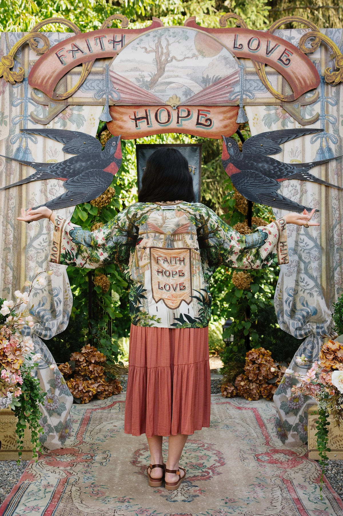 Full-length back view of Book of Love cropped kimono over a coral dress, with arms extended | Bliss by Cori