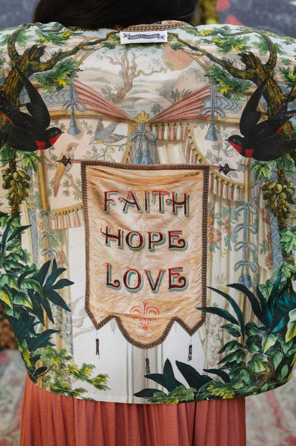Book of Love kimono back detail with Faith Hope Love banner, black swallows, vintage drapery, and foliage | Bliss by Cori