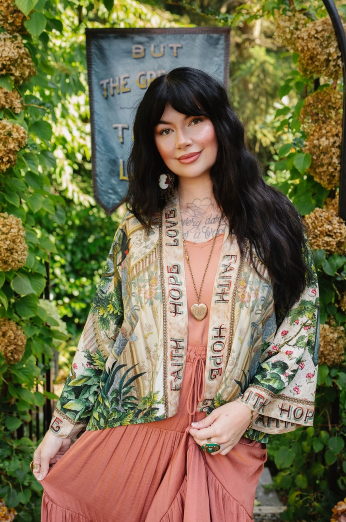  Book of Love cropped kimono layered over a coral dress, showing lettered front trim and botanical artwork | Bliss by Cori