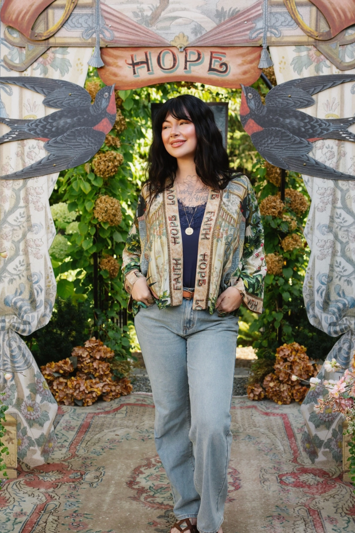 Model wearing Book of Love cropped kimono with a navy top and light blue jeans, hands in pockets | Bliss by Cori