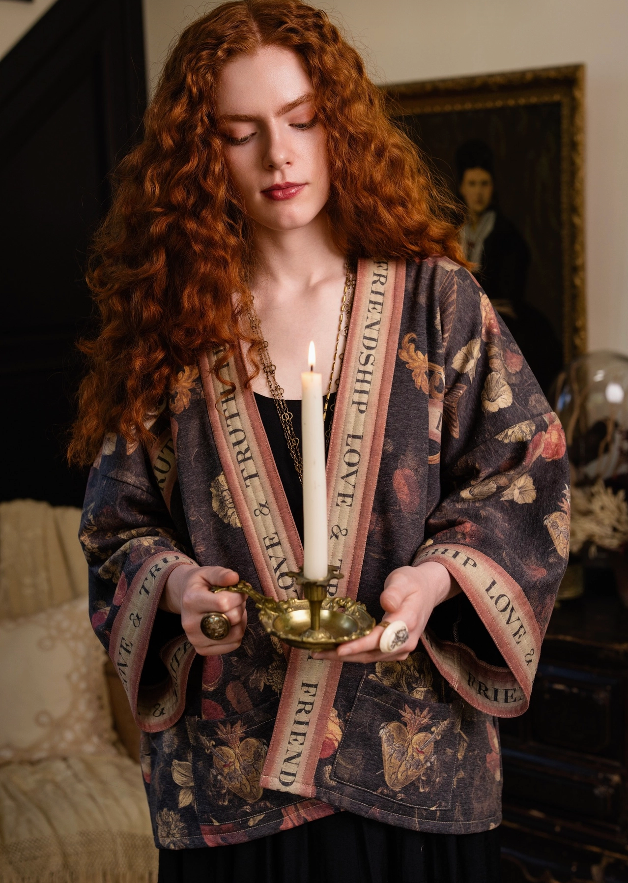 Model holding candle wearing Heart of Gold Cottage Jacket with open front | Bliss by Cori