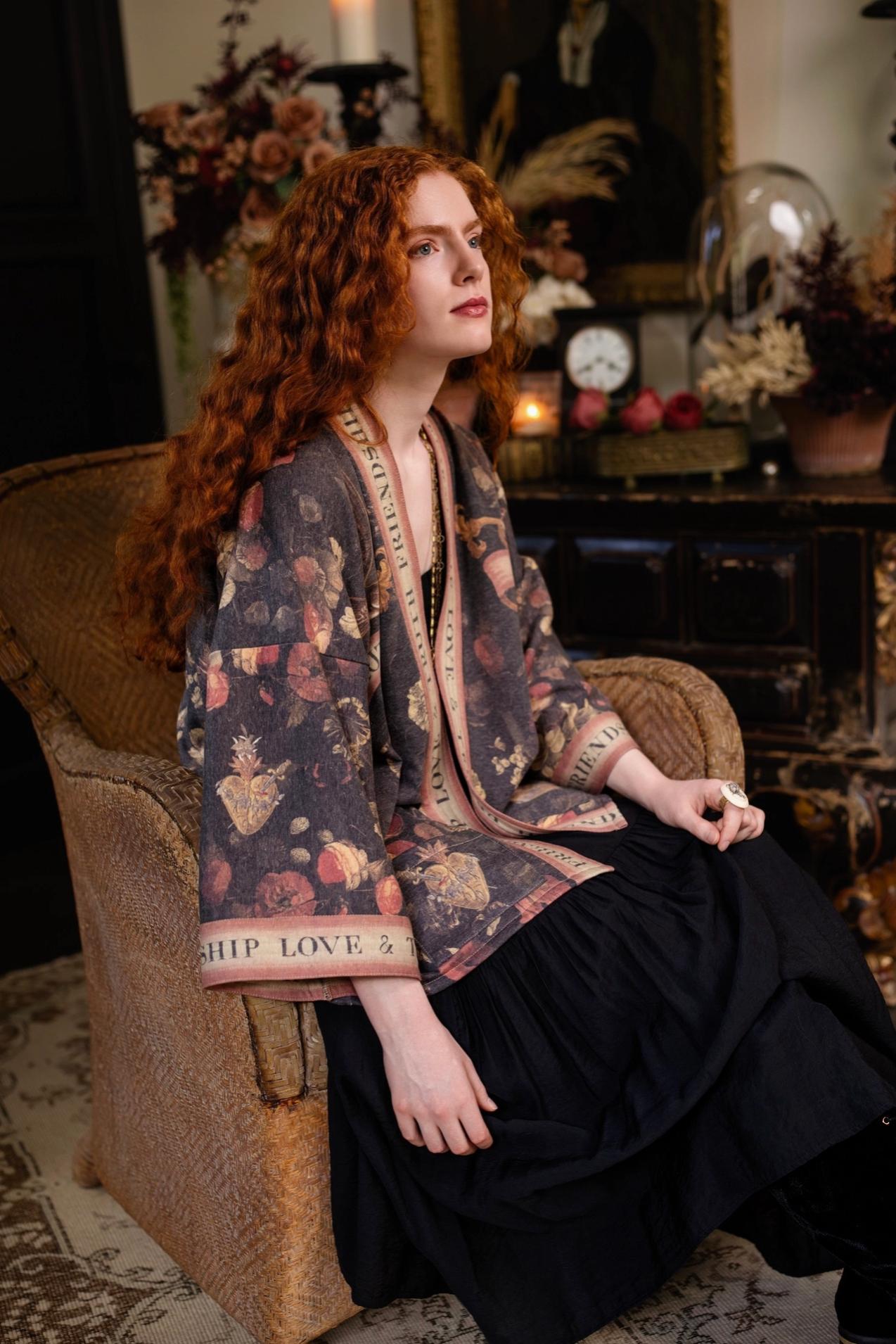 Model seated wearing Heart of Gold Cottage Jacket in moody boho interior | Bliss by Cori