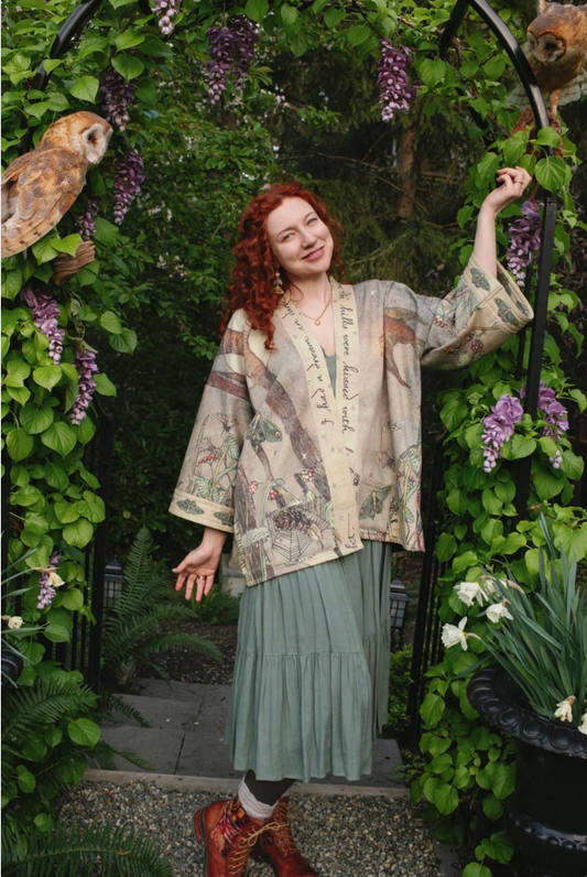 Model wearing Lovelight Cottage Jacket with owl in enchanted garden archway | Bliss by Cori