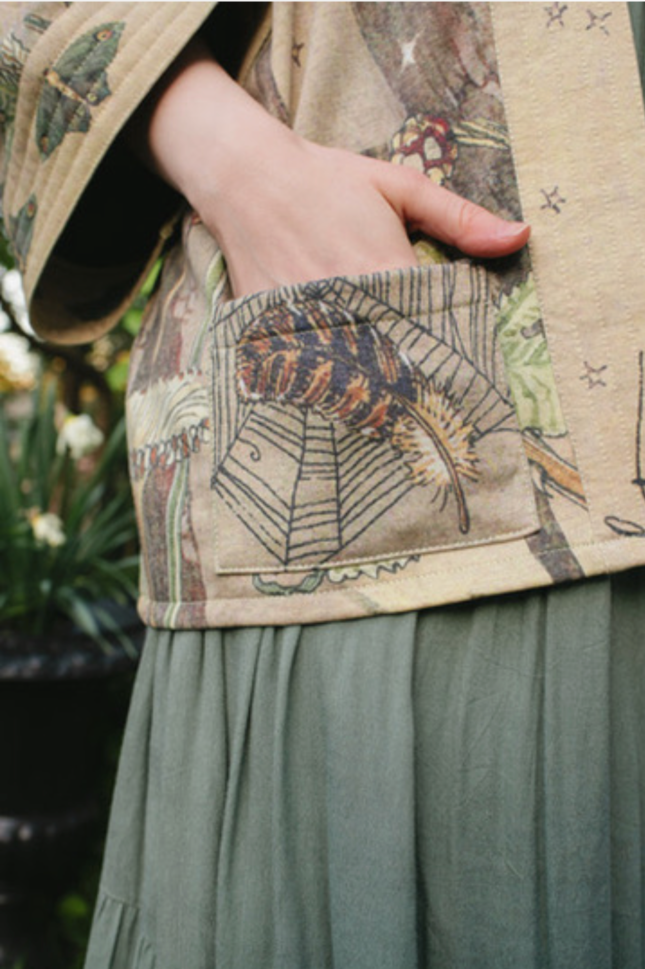 Close-up of Lovelight Cottage Jacket lapel with poetry script and woodland print | Bliss by Cori