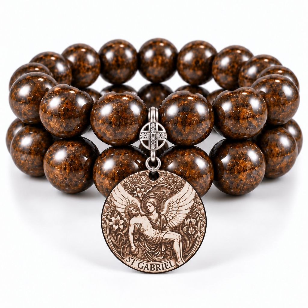 Two stacked bronzite bead bracelets with a round three-archangels medal and decorative silver-tone bail on a white background | Bliss by Cori