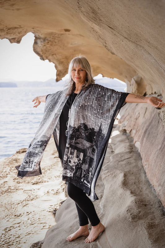 Stargazer Goddess Duster Kimono with celestial meteor shower print worn in a sandstone cave — boho-luxe goddess kimono | Bliss by Cori Boutique